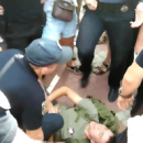 В Николаеве полицейский наступил на голову лежащему в наручниках мужчине (видео)